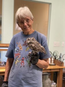 Woman holding an owl